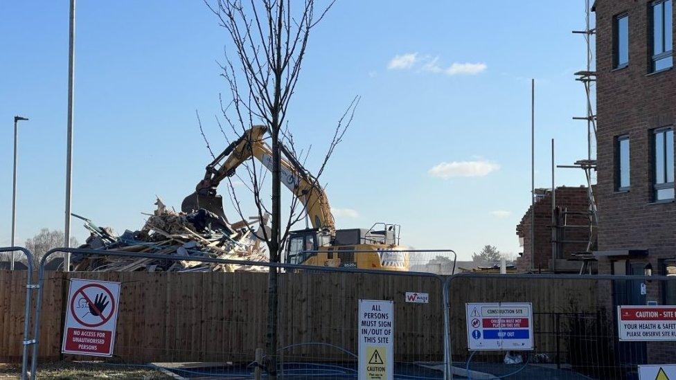 Digger at site of housing development