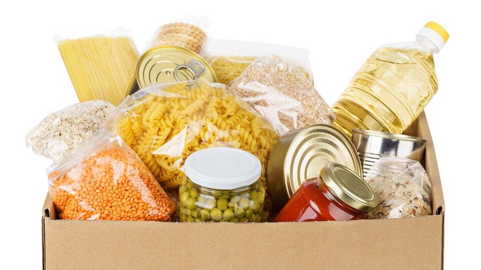 Tinned and dried food in a box.