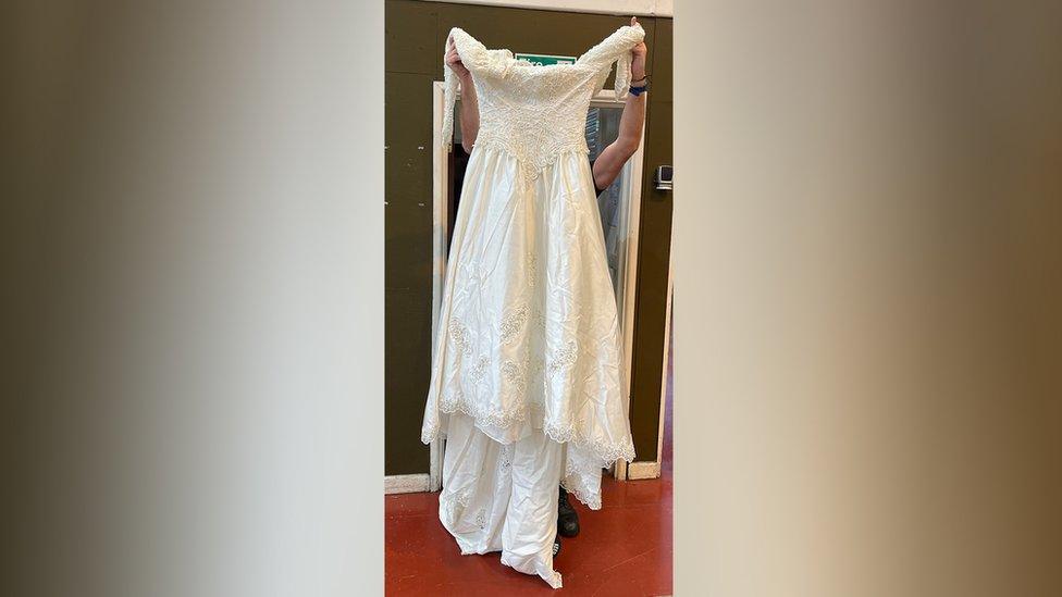 Wedding dress being held up