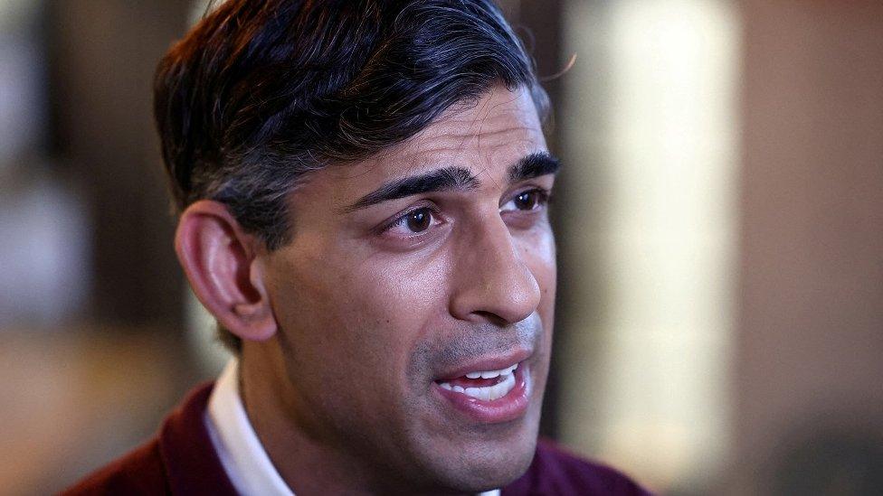 ritain's Prime Minister Rishi Sunak speaks to the press during