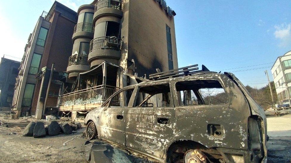 Buildings and vehicle damaged during a wildfire are seen in Goseong, South Korea, April 5, 2019