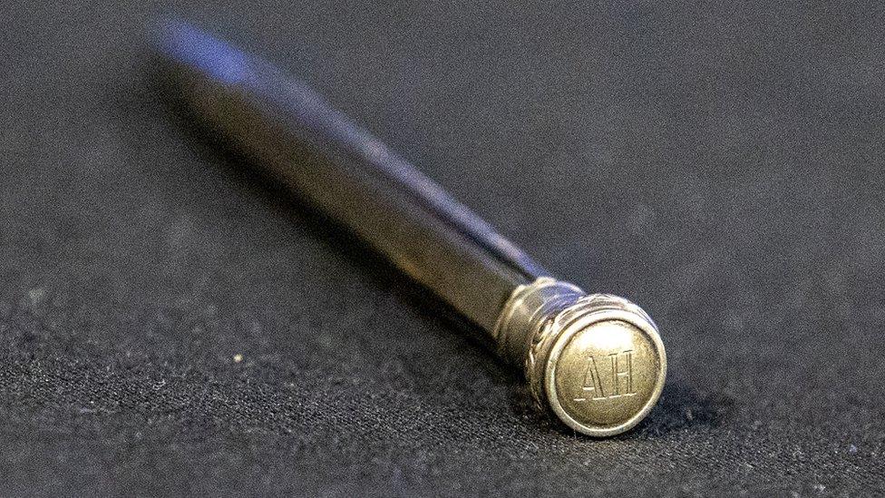 The pencil engraved with the initials "AH"