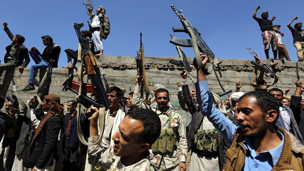 Yemenis shout slogans and brandish weapons during an anti-Saudi rally protesting Saudi-led airstrikes on a funeral hall, outside the UN offices in Sana"a, Yemen, 09 October 2016.