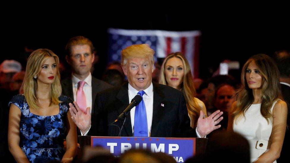 Republican U.S. presidential candidate Donald Trump speaks as (L-R) his daughter Ivanka, son Eric, Eric"s wife Lara Yunaska and his wife Melania look on