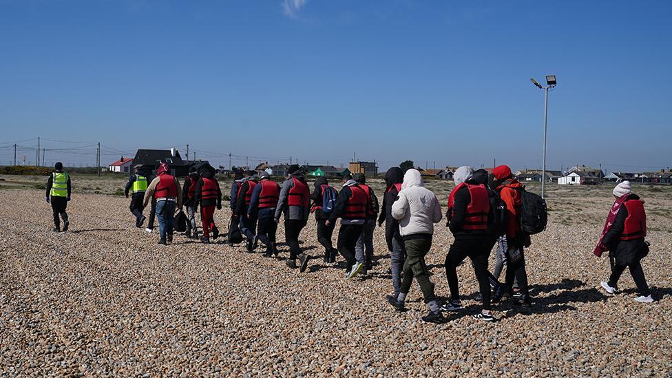 A group of people thought to be migrants are brought in to Dungeness, Kent, by the RNLI, following a small boat incident in the Channel. Picture date: Tuesday April 4, 2023.