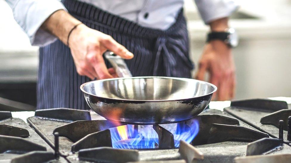 Chef using gas hob