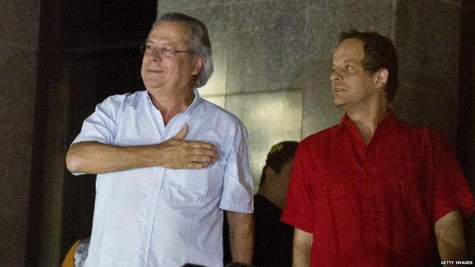 Jose Dirceu (left), former Chief of Staff of President Luiz Inacio Lula da Silva accused in the Mensalao scandal, arrives at the headquarters of the Federal Police in Sao Paulo, Brazil on 15 November, 2013.