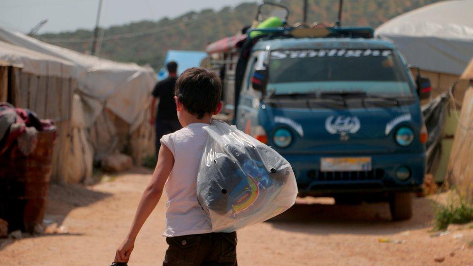 Syrian-family-in-refugee-camp.