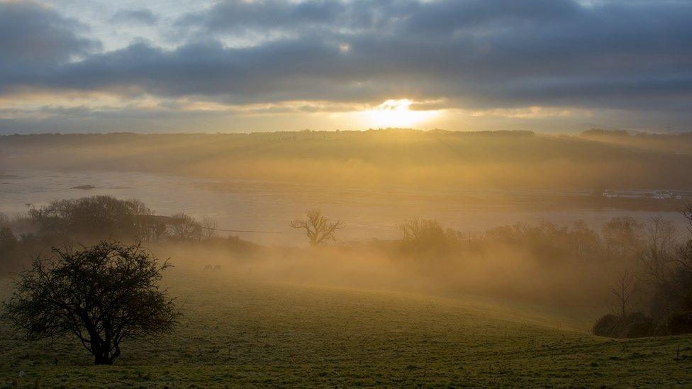 The sun shines through mist over the Menai Strait, taken by Rupert Jones