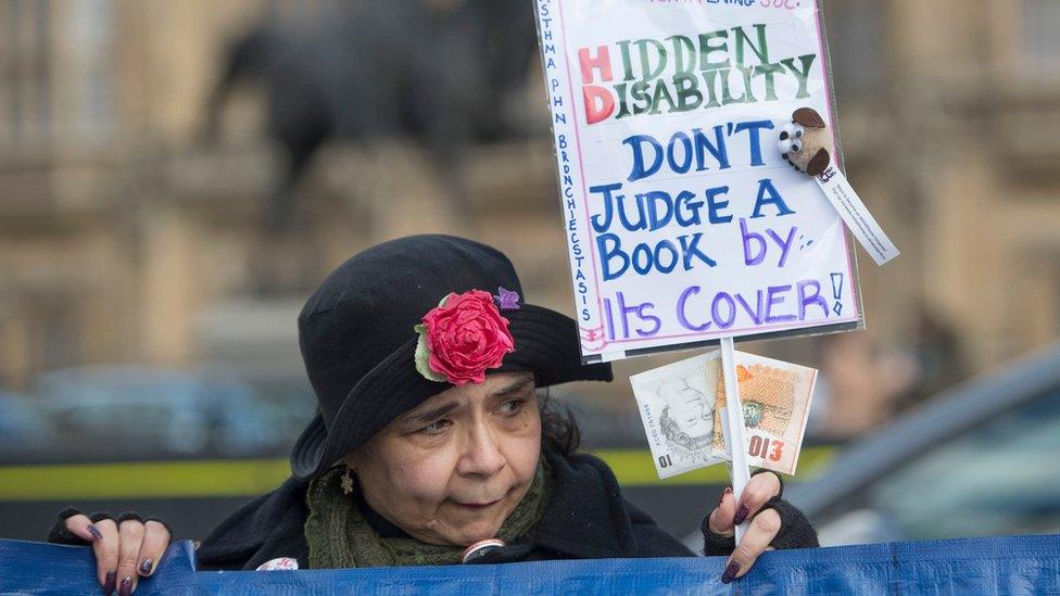 Woman protesting PIP changes