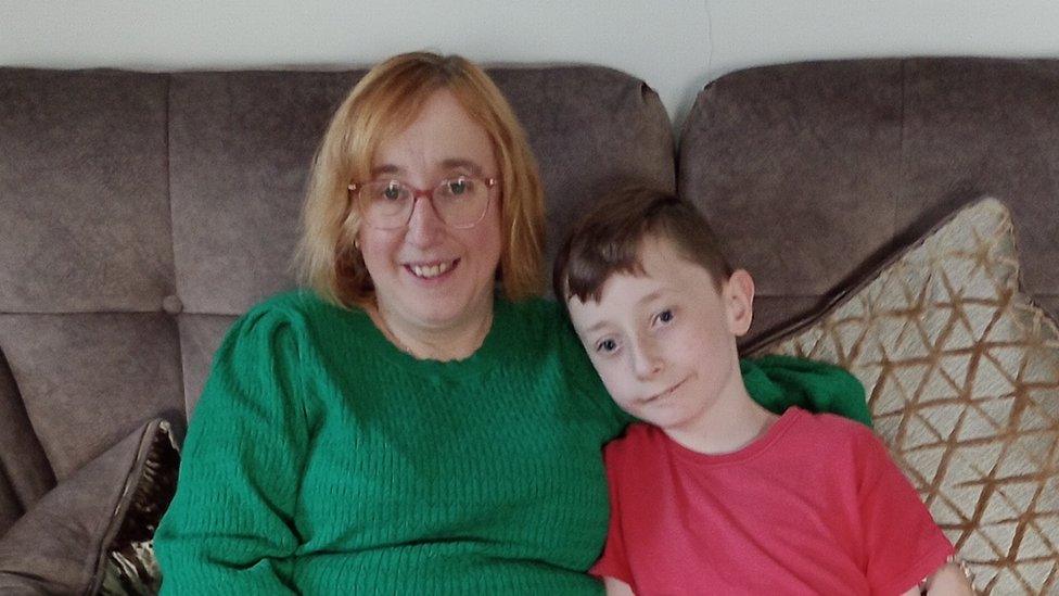 Beckie and her son sitting on the sofa