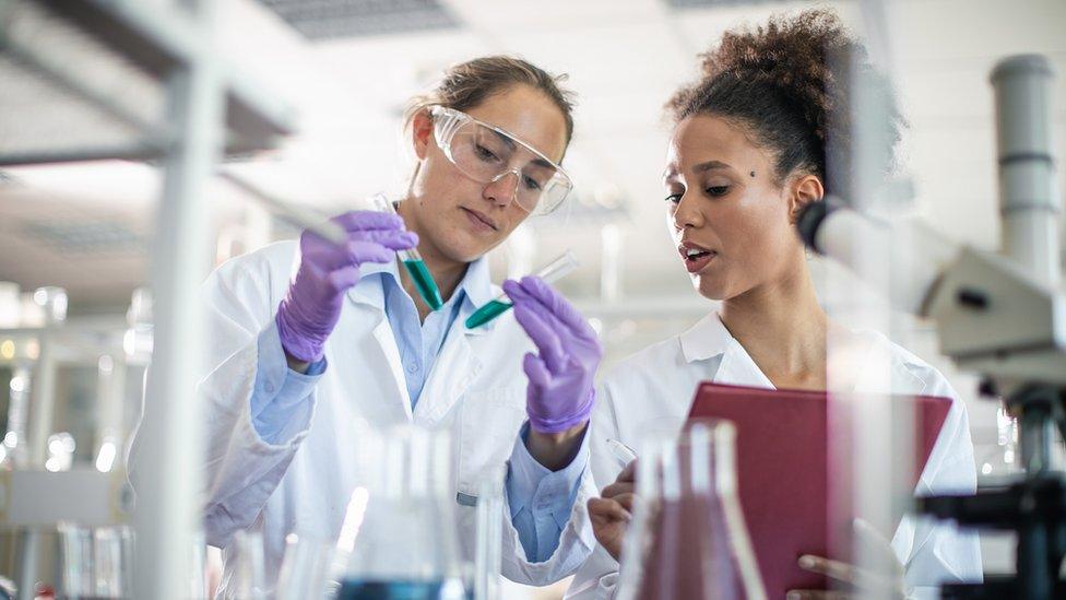 Scientists working in a lab.