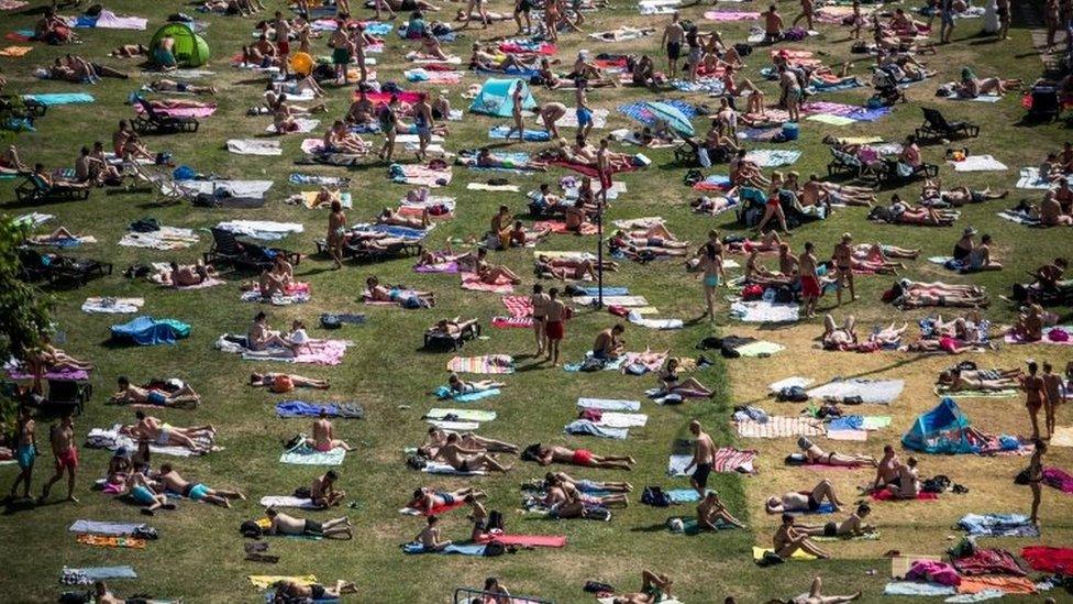 The Prague public soak up the sun