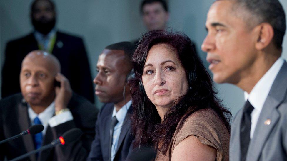 Miriam Celeya, second from right, listens President Barack Obama speaks during their meeting at the U.S. Embassy, Tuesday, March 22, 2016, in Havana, Cuba