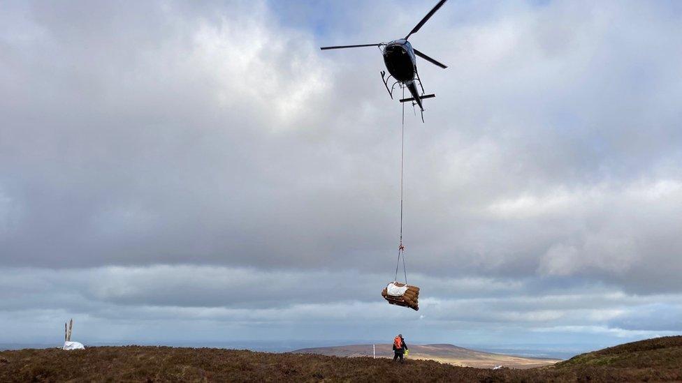 Helicopter over bogland