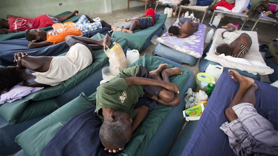 Sick prisoners rest in the infirmary at the National Penitentiary in downtown Port-au-Prince