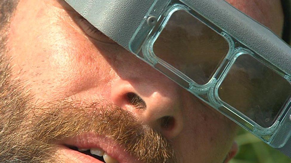 Man in magnifying goggles