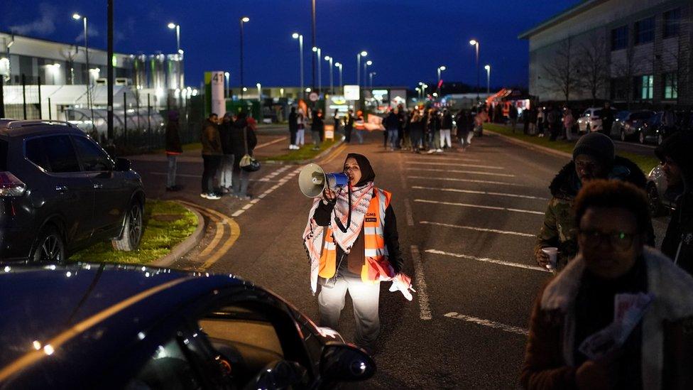 Amazon worker protesting with megaphone