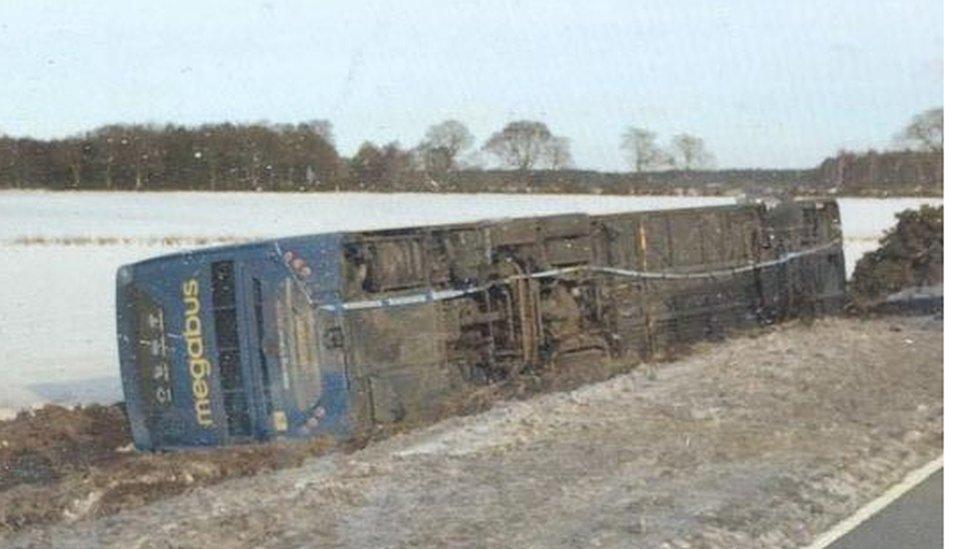 Overturned bus on A90