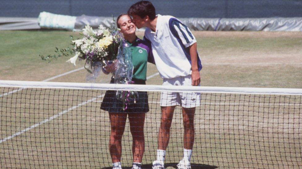 Tim Henman apologises to ball girl after hitting her with a tennis ball during a match at Wimbledon.