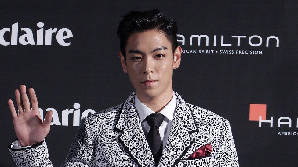 T.O.P. of Bigbang arrives for the Marie Claire Asia Star Awards during the 18th Busan International Film Festival on October 5, 2013 in Busan, South Korea.