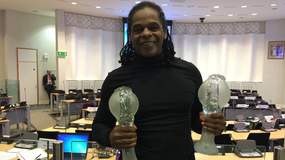 Lenny Paul with Olympic trophies