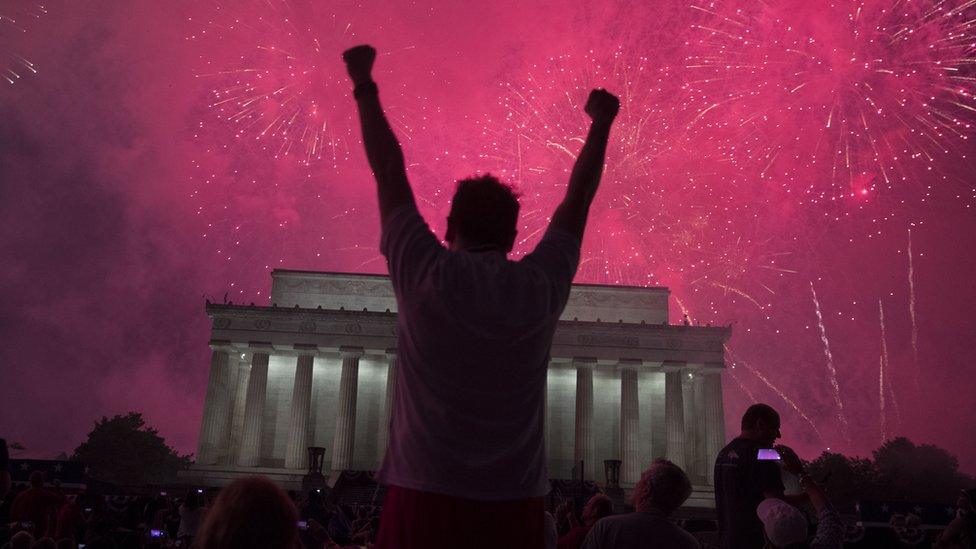 A fireworks display follows the "Salute to America" ceremony in front of the Lincoln Memorial