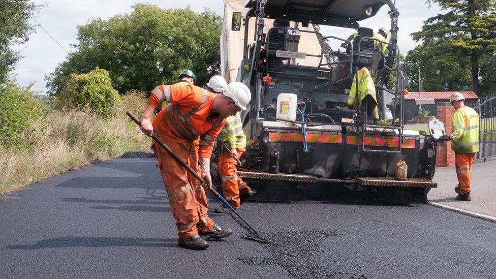 Workers repairing road