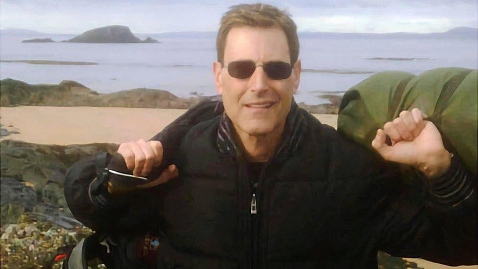 Uri Geller with Lamb Island in background, 2010