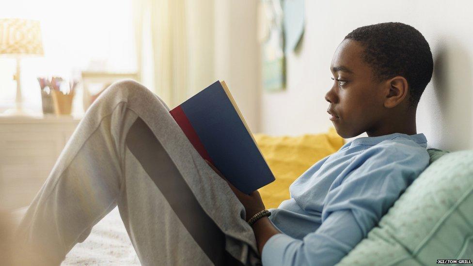 Boy reading a book