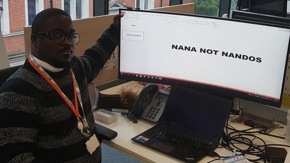 Nana Marfo sits next to his computer which states "Nana not Nandos"