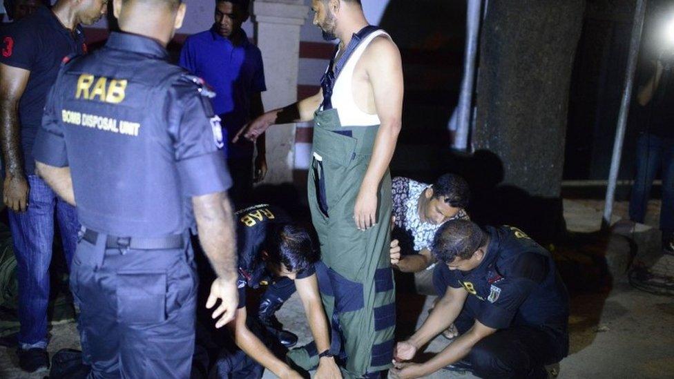 A Bangladeshi bomb disposal unit prepares to be deployed at the scene of the attack