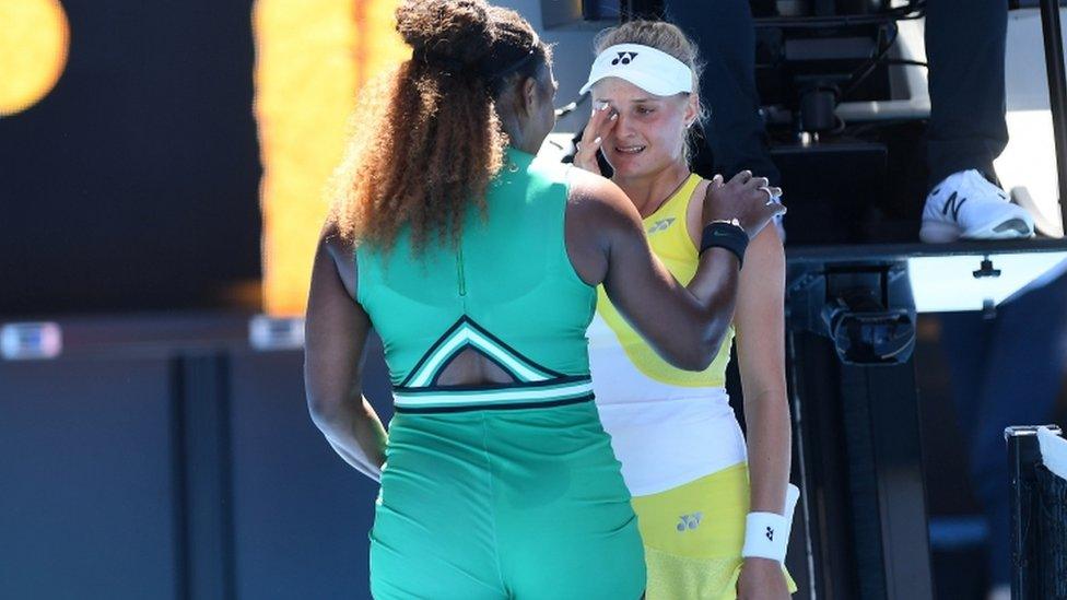 Serena Williams comforting Dayana Yastremska.