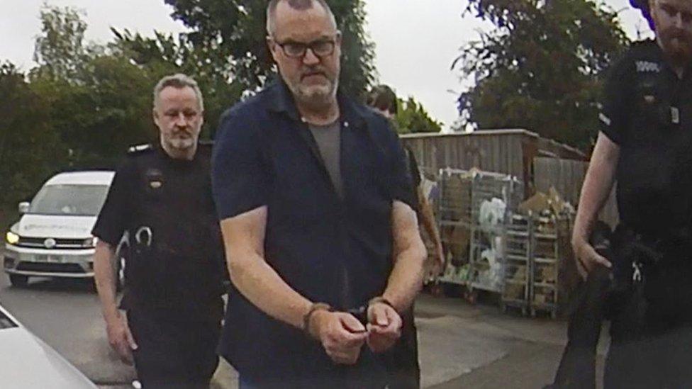 Peter Macdiarmid being arrested by police at the Just Stop Oil protest in Clacket Lane services