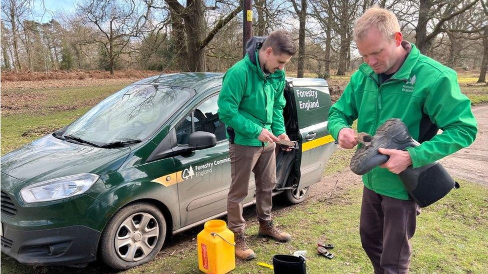 Tom Brockington and James Williams cleaning their boots