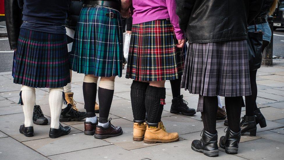 People wearing kilts