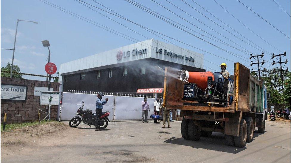 Municipal personnel spray water to mitigate the presence of gases in the air a day after a gas leak incident around the area of LG Polymers plant in Visakhapatnam