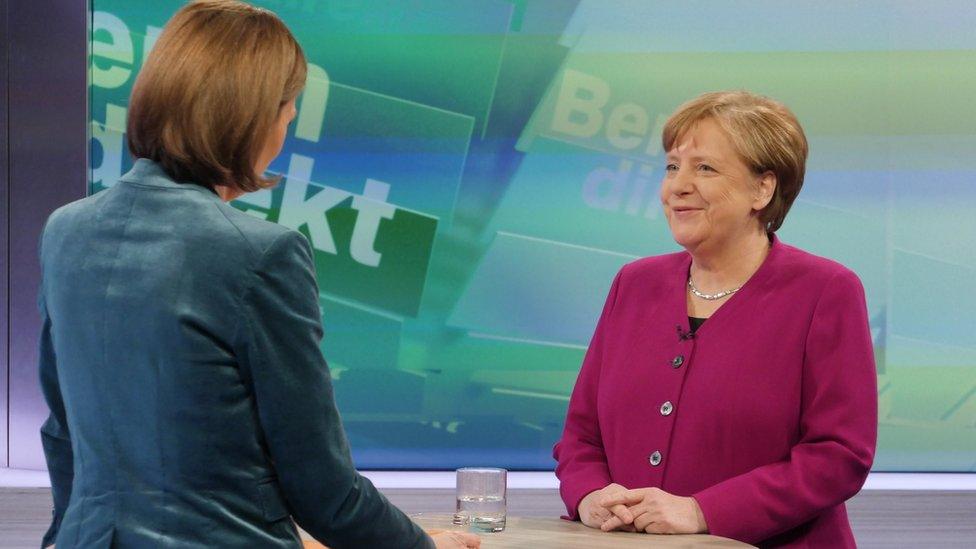 Merkel (R) appears on ZDF