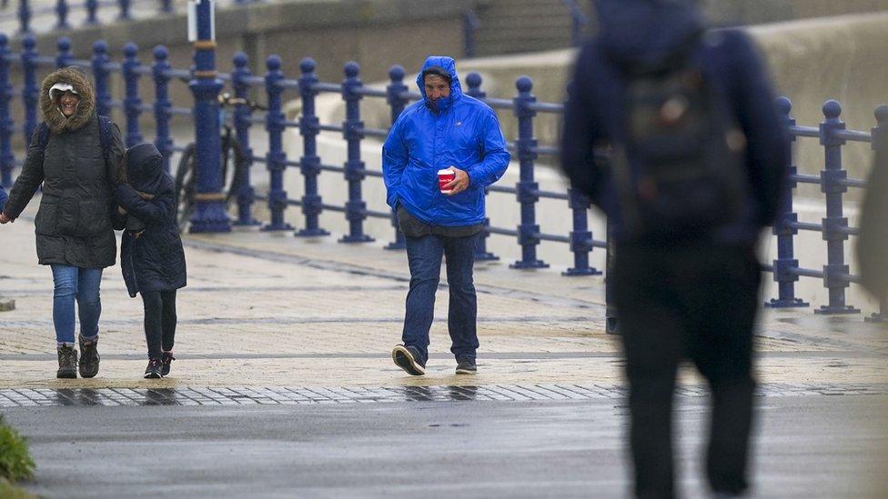 People brave the rain