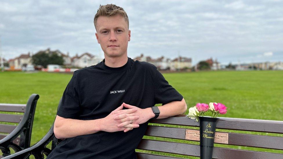 A man sits on a bench