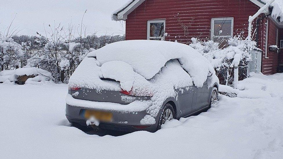 A snow-covered car in Carlops, in the Scottish Borders