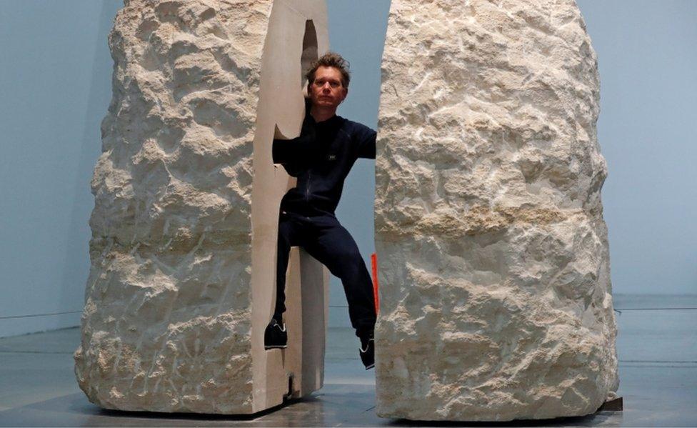 French artist Abraham Poincheval poses inside his artwork Pierre ("Stone") in Paris, France, February 22, 2017, before entering the rock as part of his project to live inside for a week.