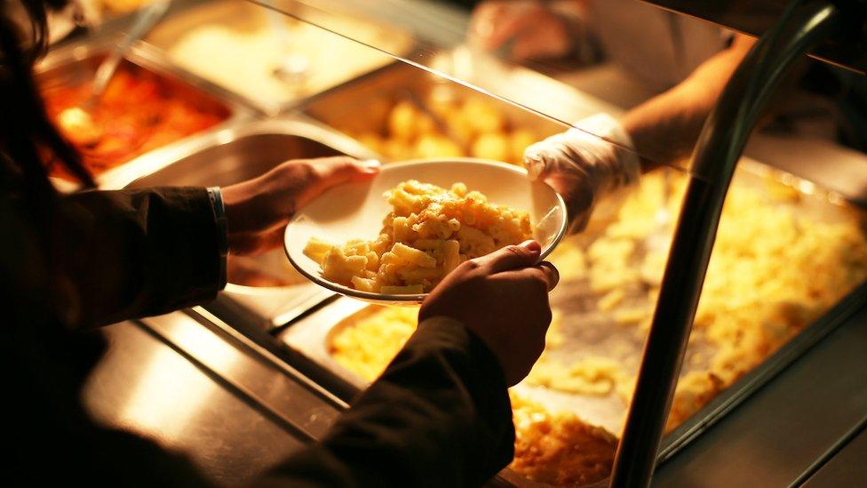 A child is given school meal