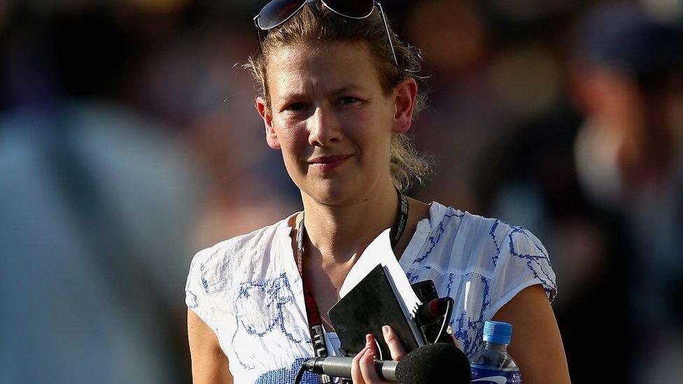 Jennie Gow with microphone and sunglasses