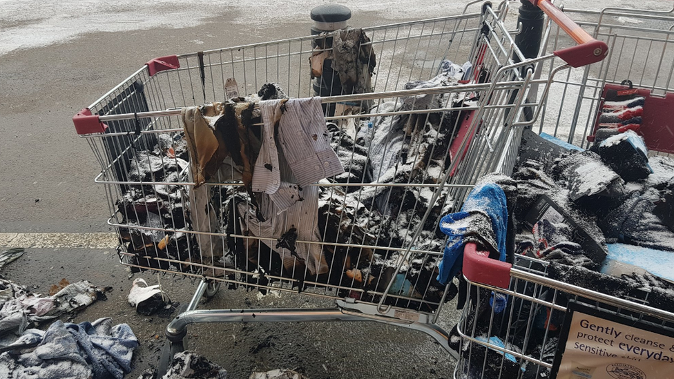 Trolley with burnt clothes