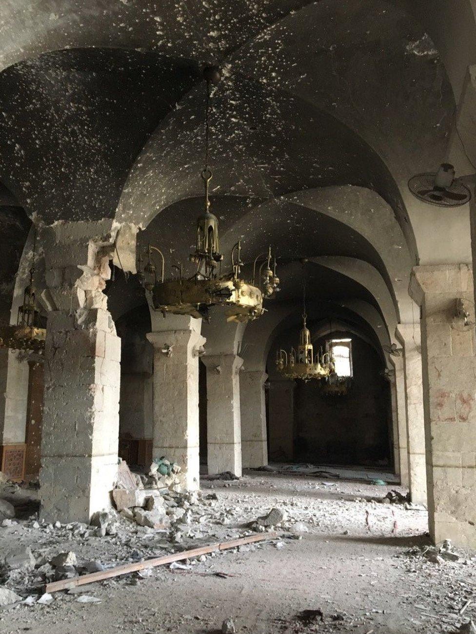 Inside the mosque where candelabras still hang from the ceiling