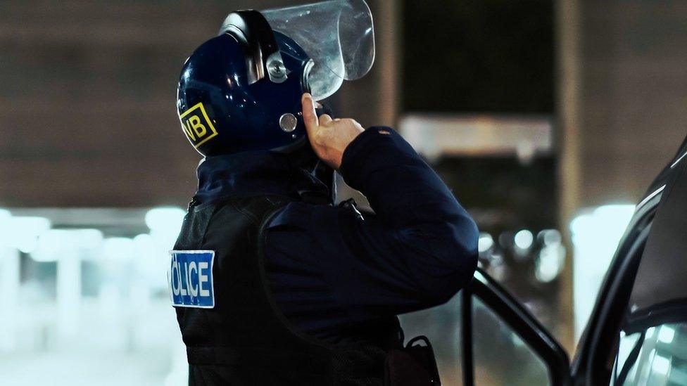 Police officer with a helmet on