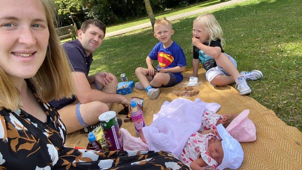 Alex Wright and his family having a picnic.