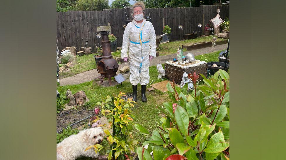 Lesleyanne in garden with her dog