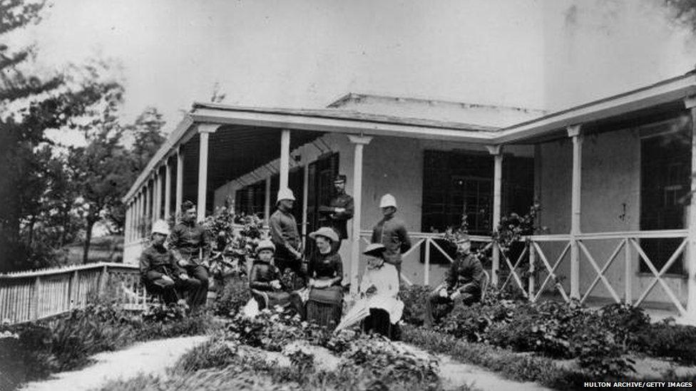 circa 1880: A group of British expatriates, some in military uniform, sitting outside their house in India. (Photo by Hulton Archive/Getty Images)